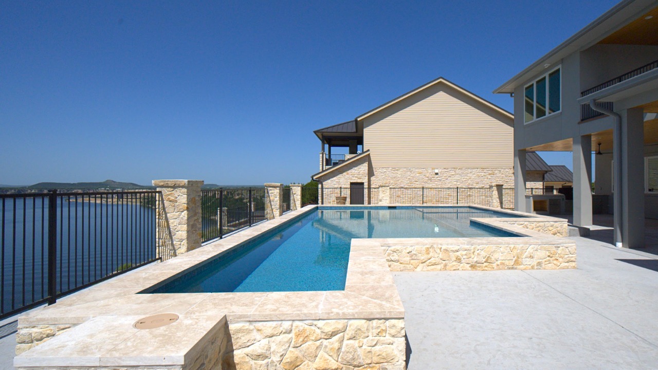 Custom Cornerstone pool build overlooking the lake